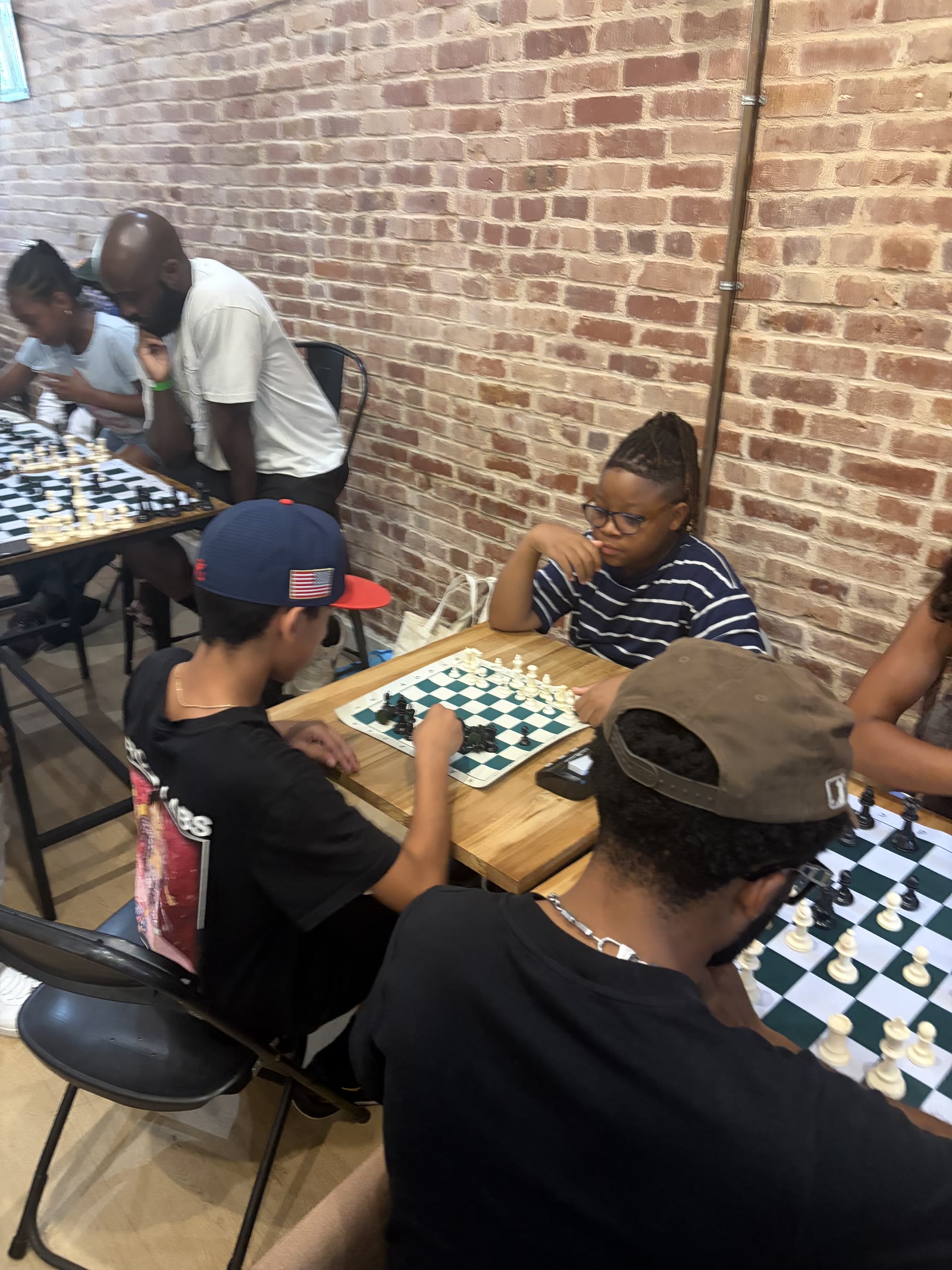 Xavier playing chess in the community 1
