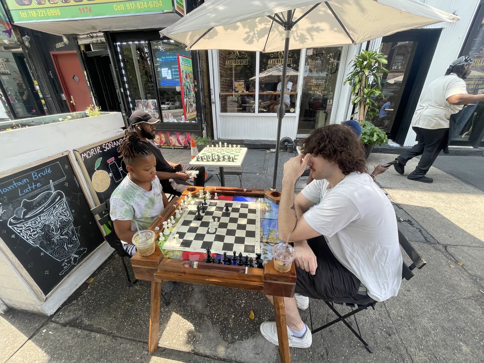 Xavier playing chess in the community 6