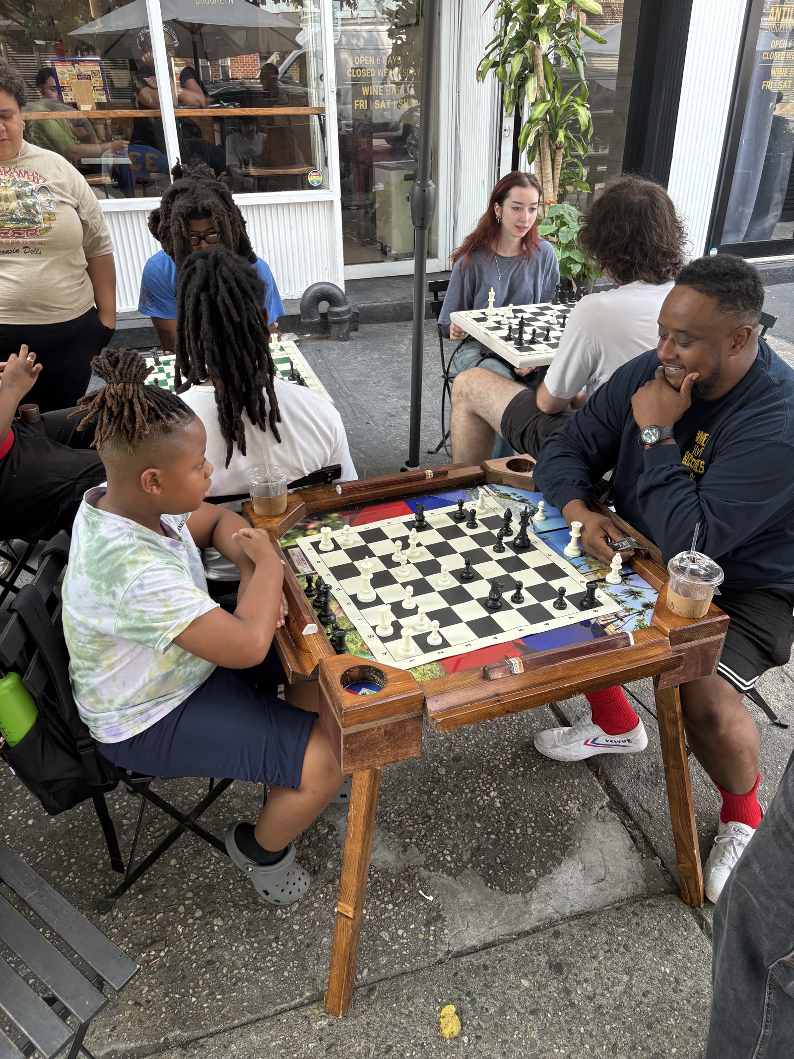 Xavier playing a game during a chess lesson